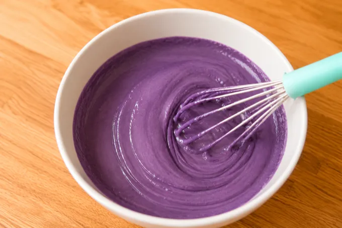 Ube batter mixture in a bowl