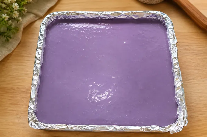 Ube chiffon cake batter spread in baking tray