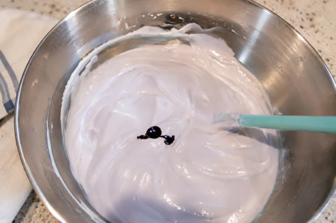 Ube meringue mixture being whisked